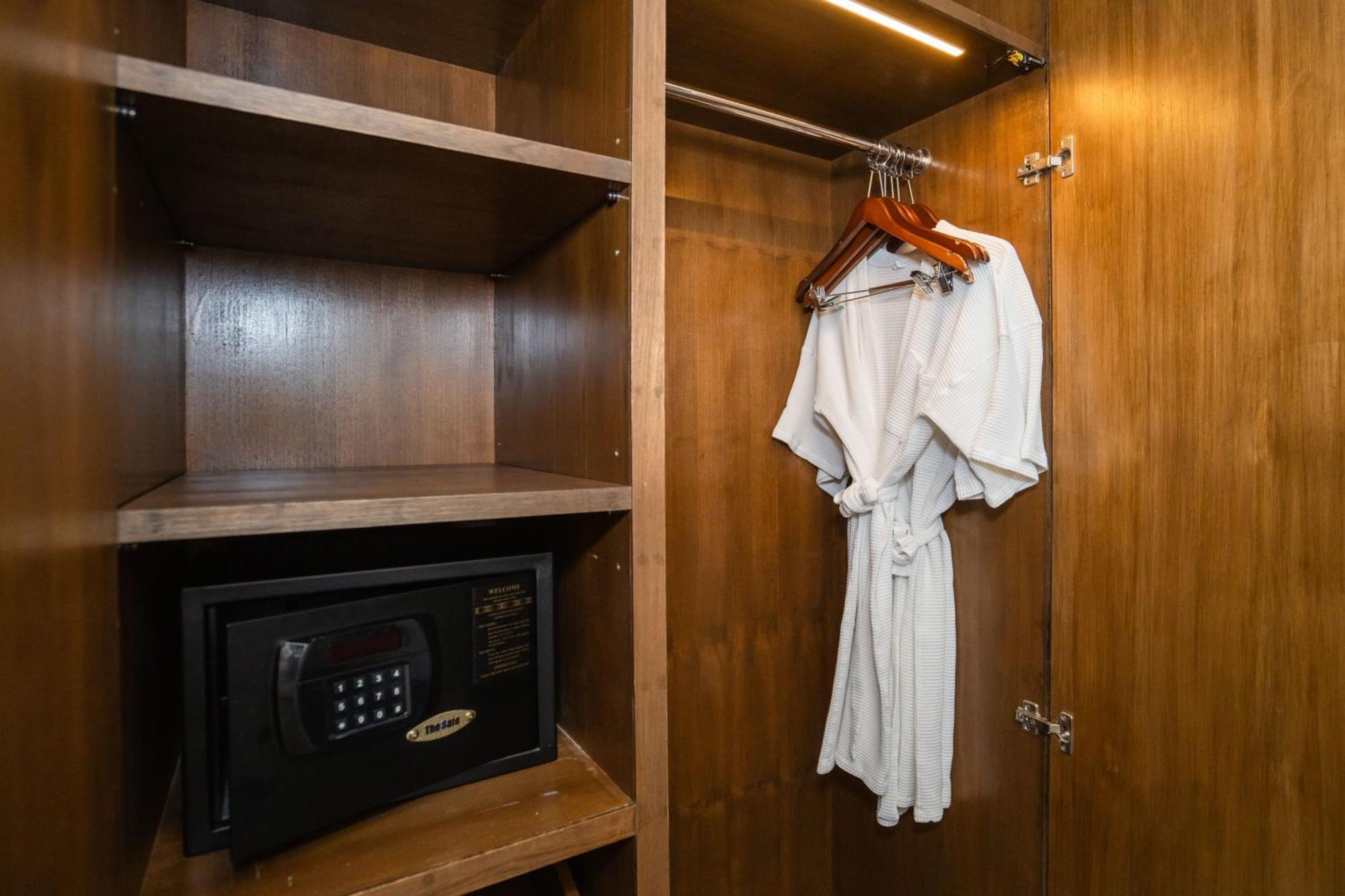 Le Resort And Villas Rawai Экстерьер фото A bathrobe hanging in a closet